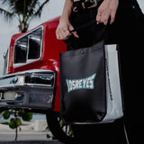 LosReyes black shopping bag – product detail by red car, fashion accessory Designed in Miami