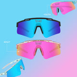 Four pairs of colorful sunglasses with different lens colors on a gradient blue and pink background from LosReyes brand, polarized sports sunglasses