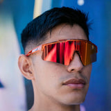 Lifestyle front view of LosReyes Prime Galaxy Mars performance sunglasses with bold red mirrored shield lens, perfect for outdoor training and streetwear versatility.