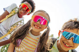 LosReyes kids sunglasses worn by smiling children with backpacks outside on a sunny back to school day.