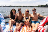 Group of people wearing Omega sunglasses while spending a sunny day on the lake.