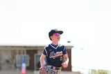 Close-up of a young athlete wearing lightweight LosReyes performance sunglasses between games.