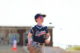 Close-up of a young athlete wearing lightweight LosReyes performance sunglasses between games.
