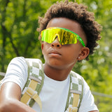 Child wearing Candy Collection Banana kids sport sunglasses with green and yellow frame outdoors
