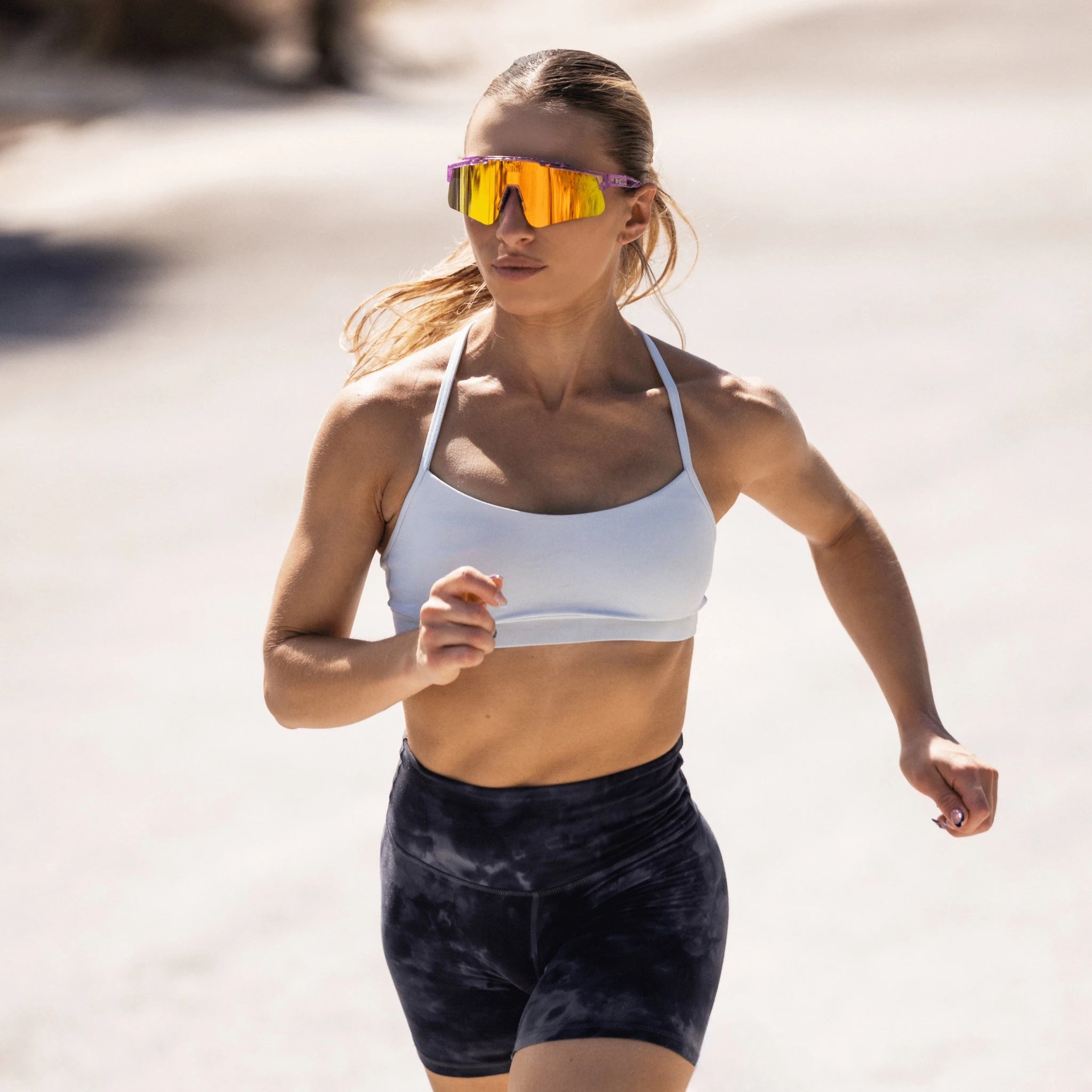 Runner training in LosReyes Mercury sunglasses with high-shine silver mirrored lens designed for athletic performance.