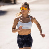 Runner training in LosReyes Mercury sunglasses with high-shine silver mirrored lens designed for athletic performance.