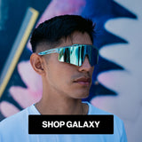 Man wearing reflective LosReyes sports sunglasses Uranus galaxy collection with a colorful abstract background and 'Shop Galaxy' text.