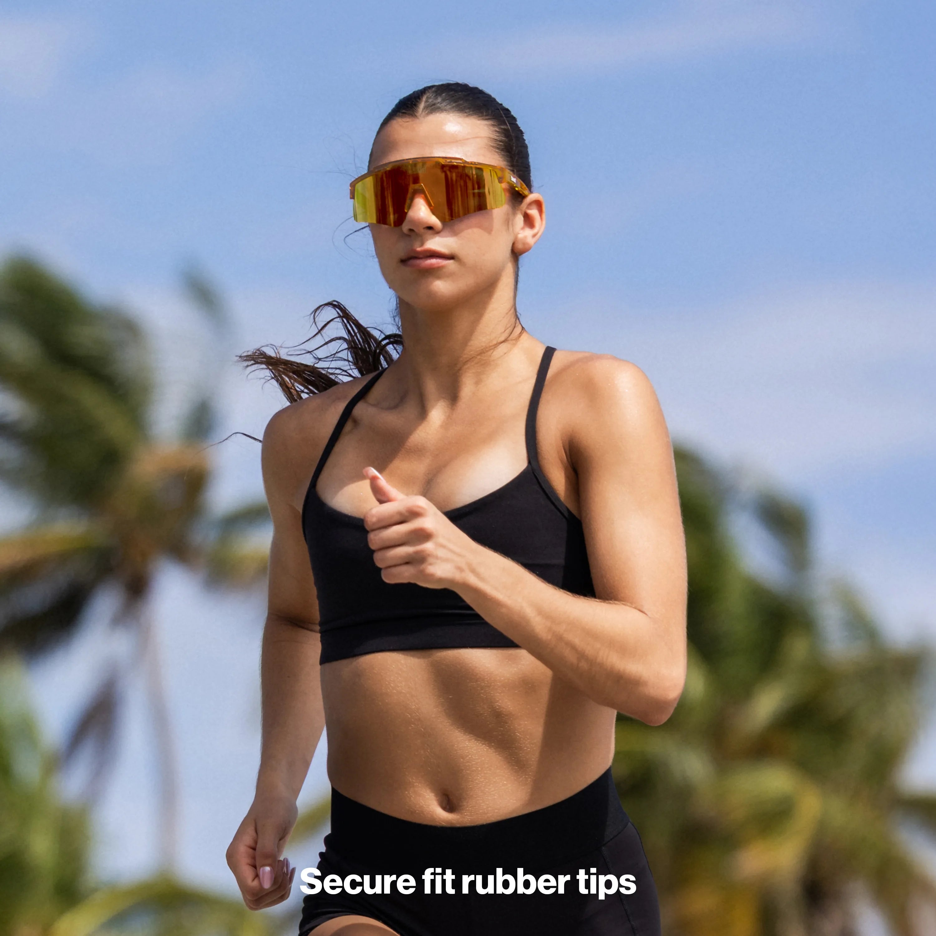 Runner wearing Jupiter high-performance shield sunglasses with mirrored lens, designed for speed, UV400 protection, and wide peripheral coverage during outdoor training