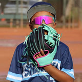 Kid baseball player wearing pink-mirror LosReyes sport sunglasses and teal glove
