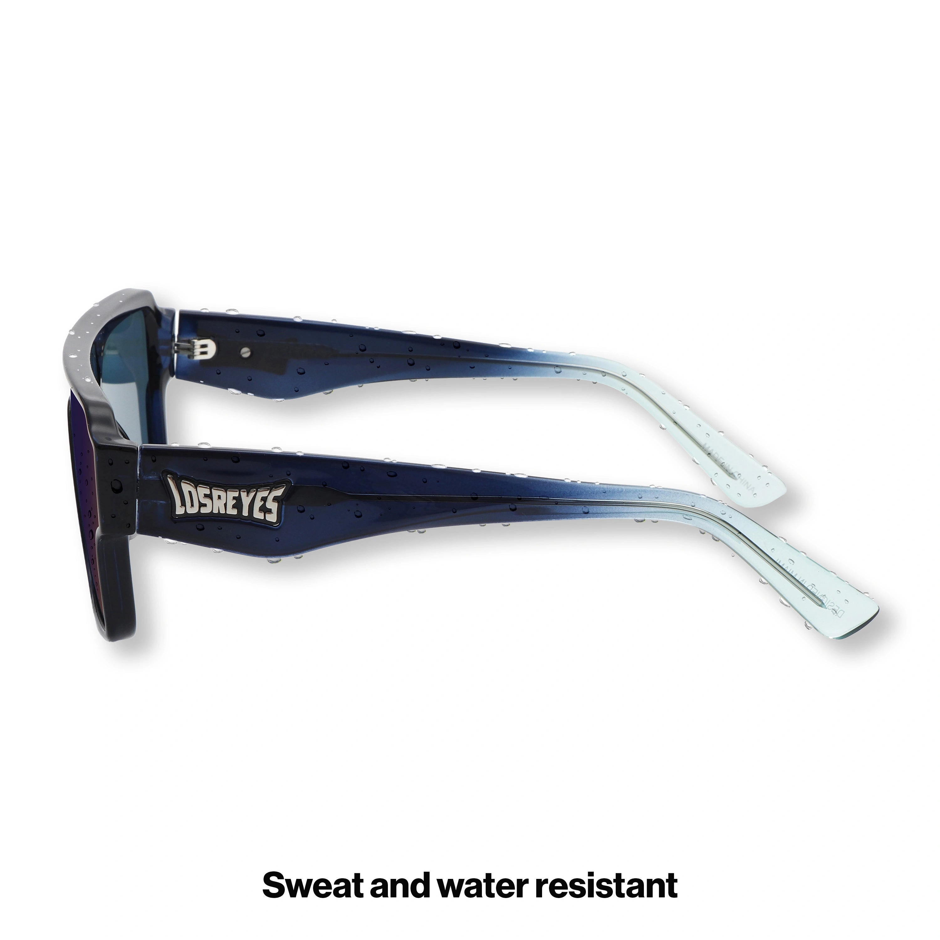 Side profile of LosReyes Omega Poseidon sport sunglasses showing translucent blue-to-clear temples, wraparound shield design, and lightweight performance build.