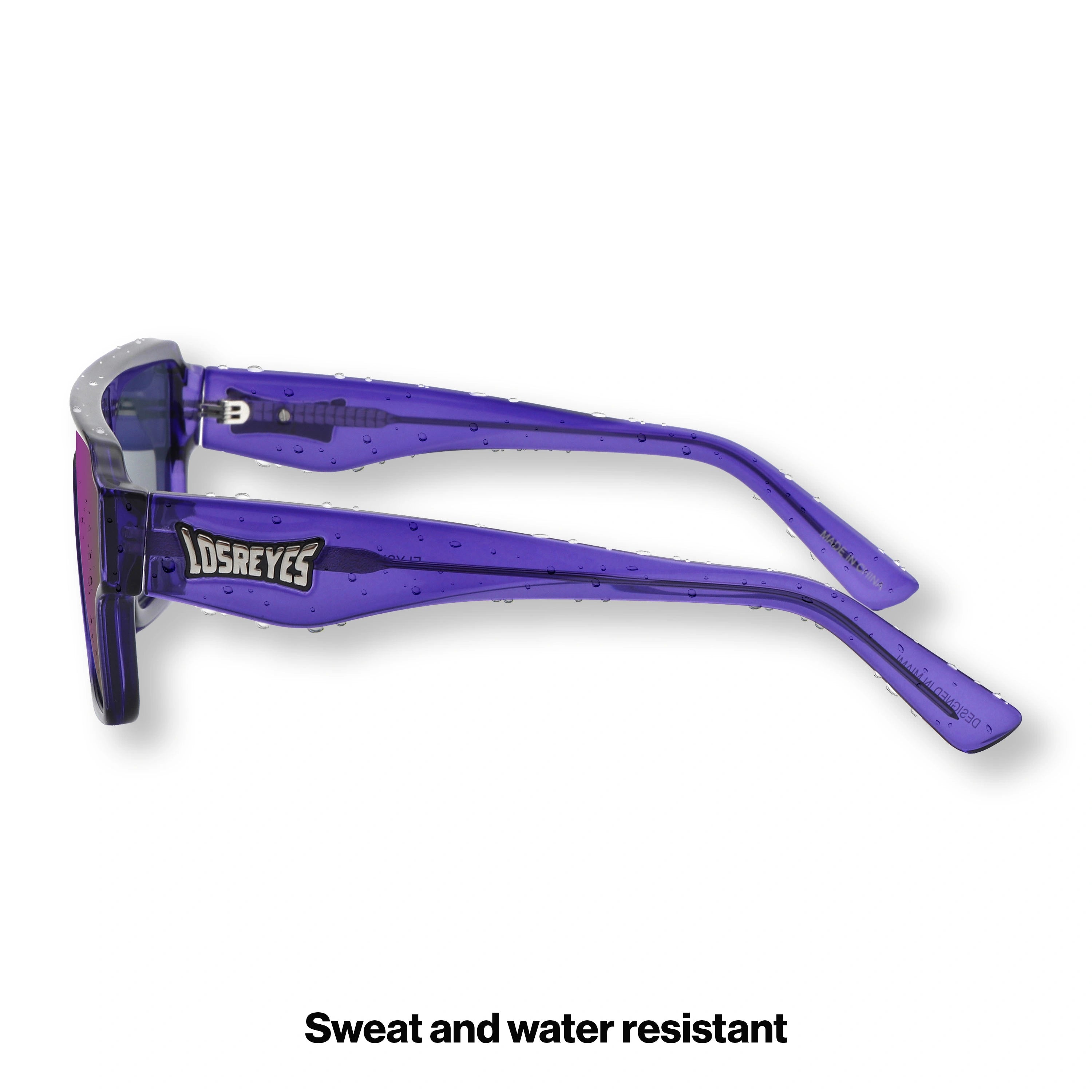 Side profile of LosReyes Omega Zeus sport sunglasses with translucent purple temples, wide-arm stability, and mirrored lens ideal for running, cycling, or street style.