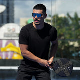 Athlete wearing LosReyes Hades sunglasses playing paddle on court