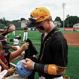 Max Clark signing autographs for kids while wearing a black Seawolves jersey, yellow cap, and LosReyes SHOWTIME sunglasses pushed up on the brim.