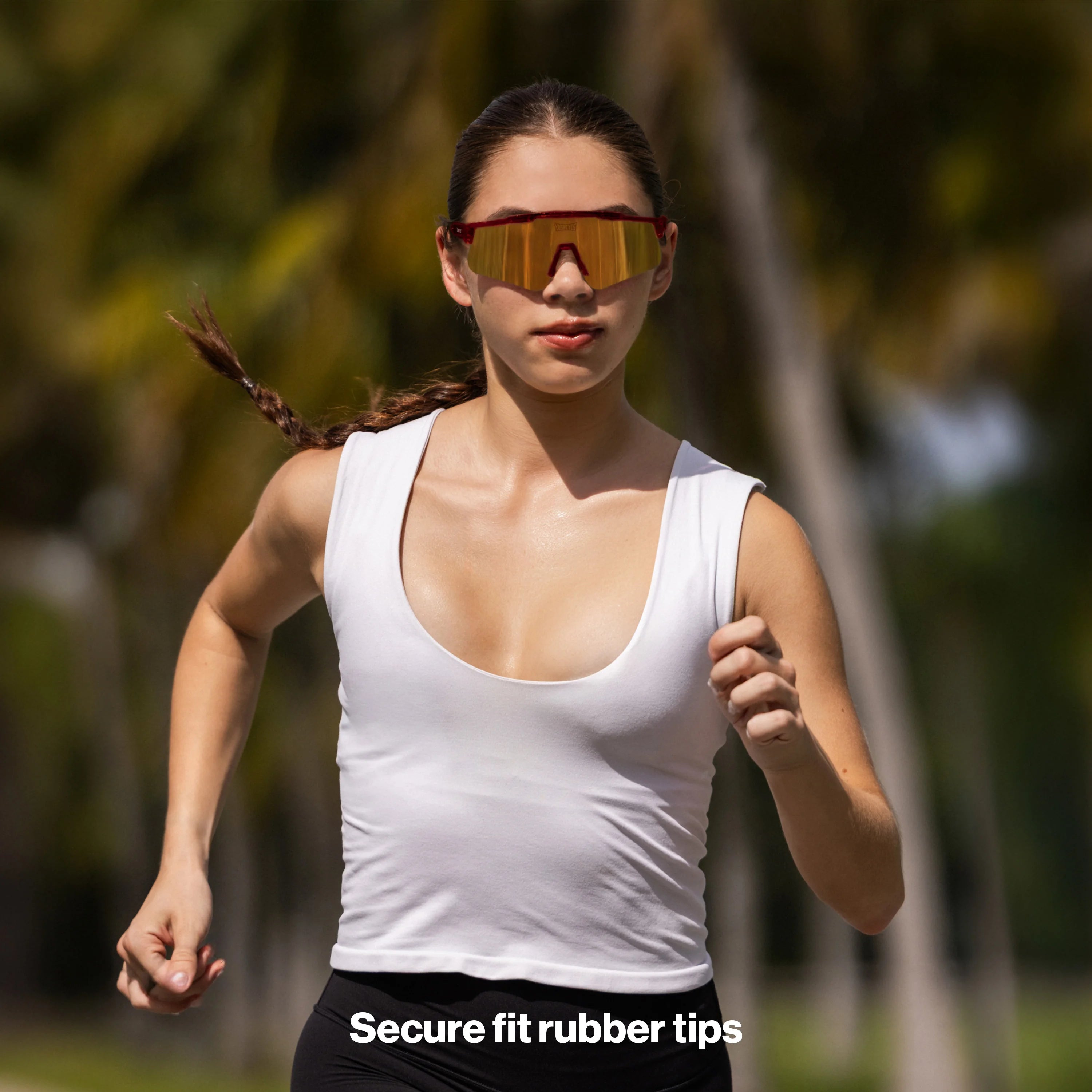 Athlete running outdoors wearing Pluto ultra-light sports sunglasses featuring a wraparound mirrored shield lens, anti-slip fit, and UV400 protection for intense workouts