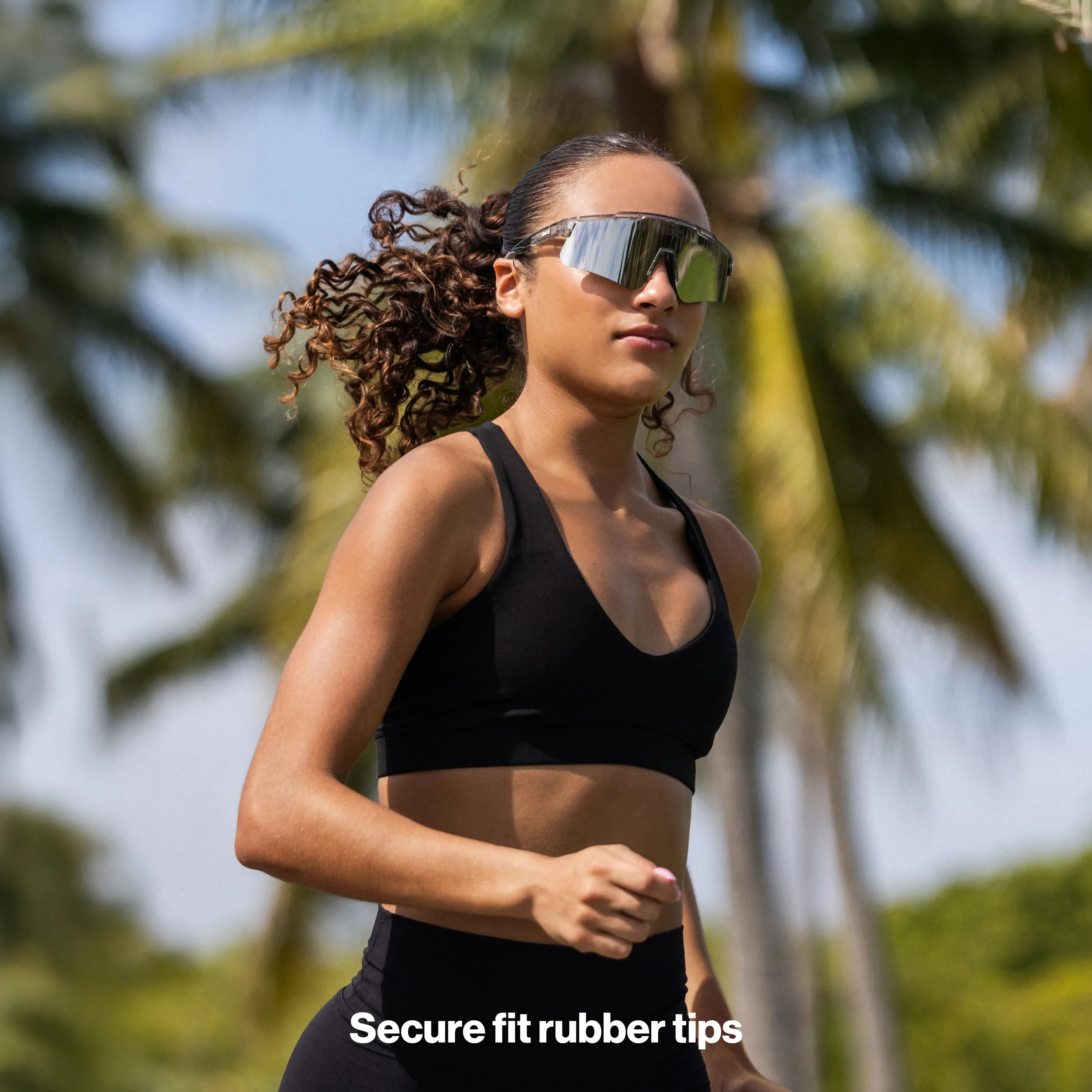 LosReyes Moon sport sunglasses with sleek silver reflective lens worn by an athlete during outdoor running.
