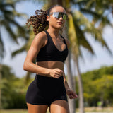 LosReyes Moon sport sunglasses with sleek silver reflective lens worn by an athlete during outdoor running.