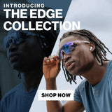 Athlete wearing mirrored shield sports sunglasses from the Edge Collection adjusting glasses during outdoor workout