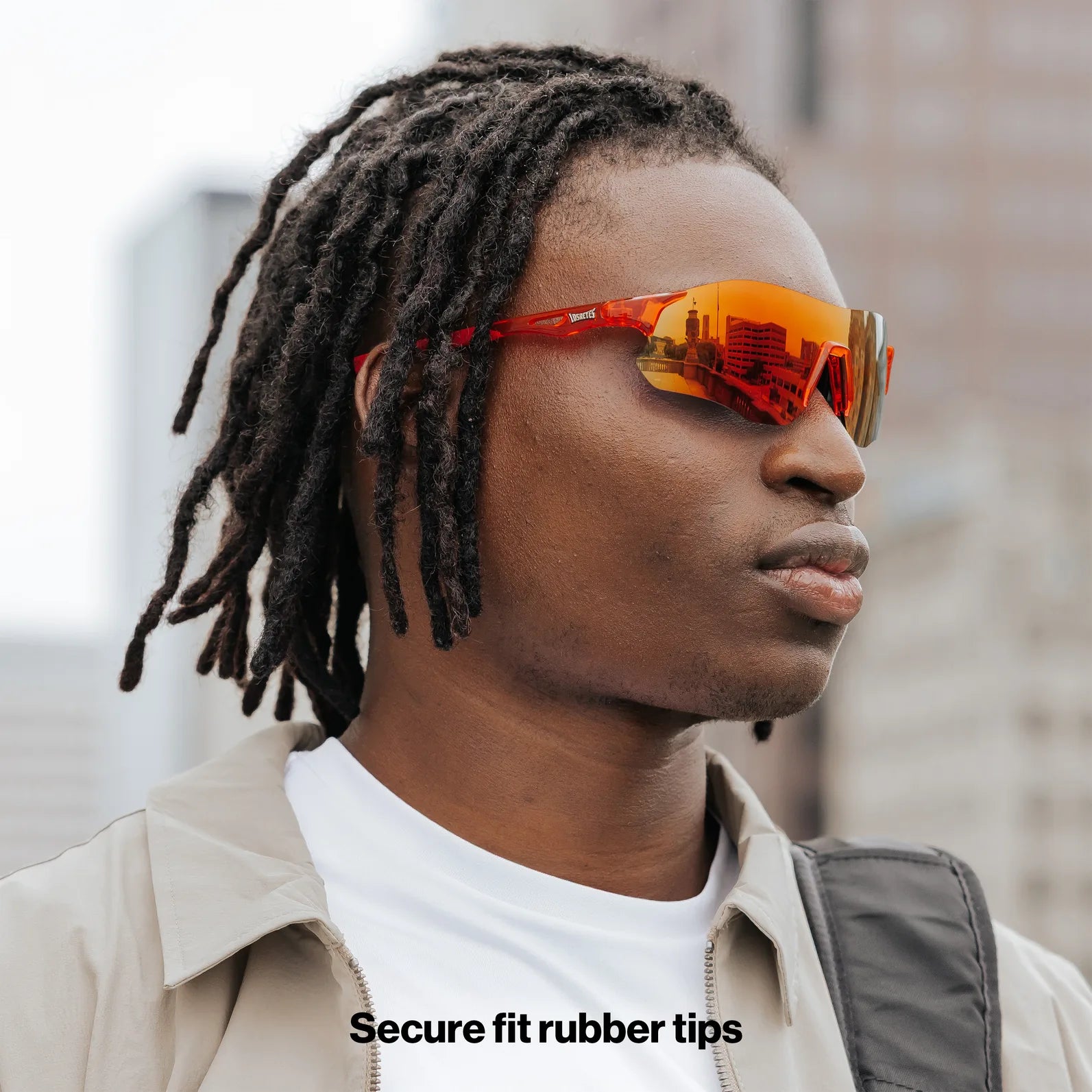 Side profile of model wearing Edge Lava sunglasses highlighting the orange-red mirrored lens finish.