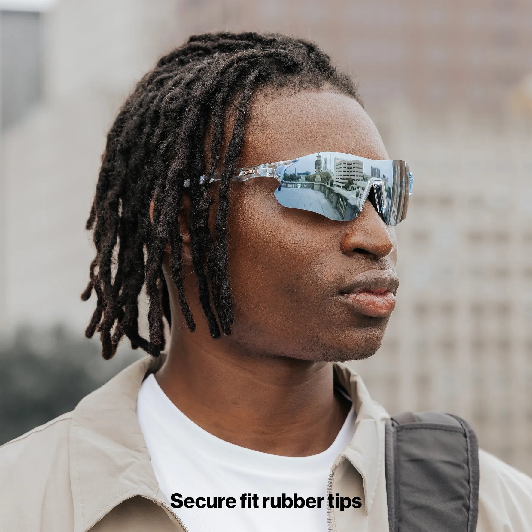 Angled close-up of Edge Ocean sunglasses showing wraparound design and blue mirrored lenses.