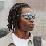 Angled close-up of Edge Ocean sunglasses showing wraparound design and blue mirrored lenses.