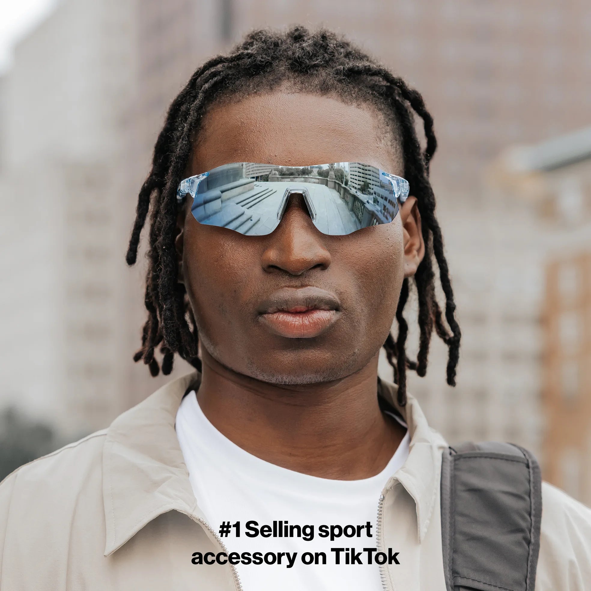 Front view of model wearing Edge Ocean sunglasses with reflective blue shield lenses.