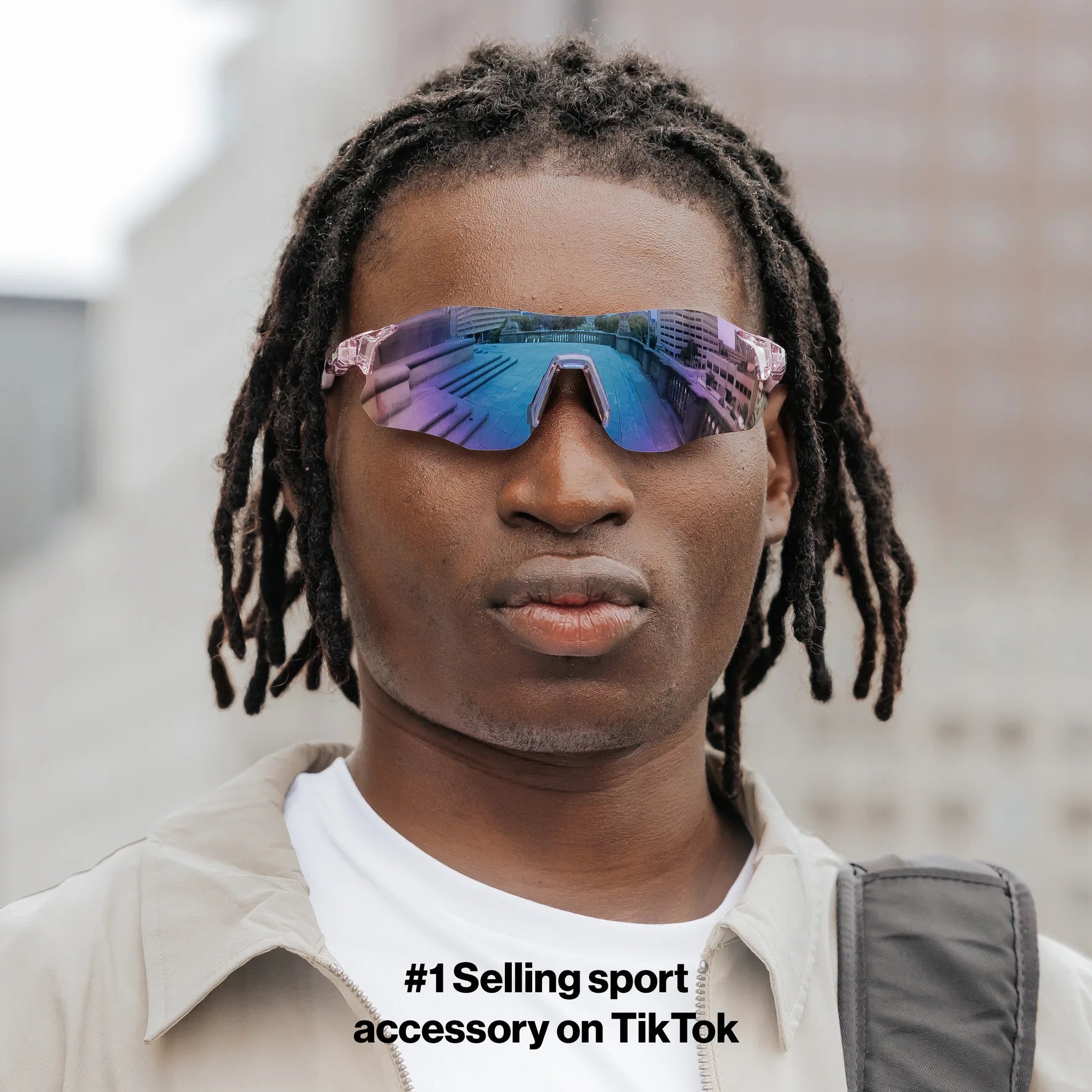 Front-facing view of model wearing Edge Royal sunglasses with purple reflective shield lenses.