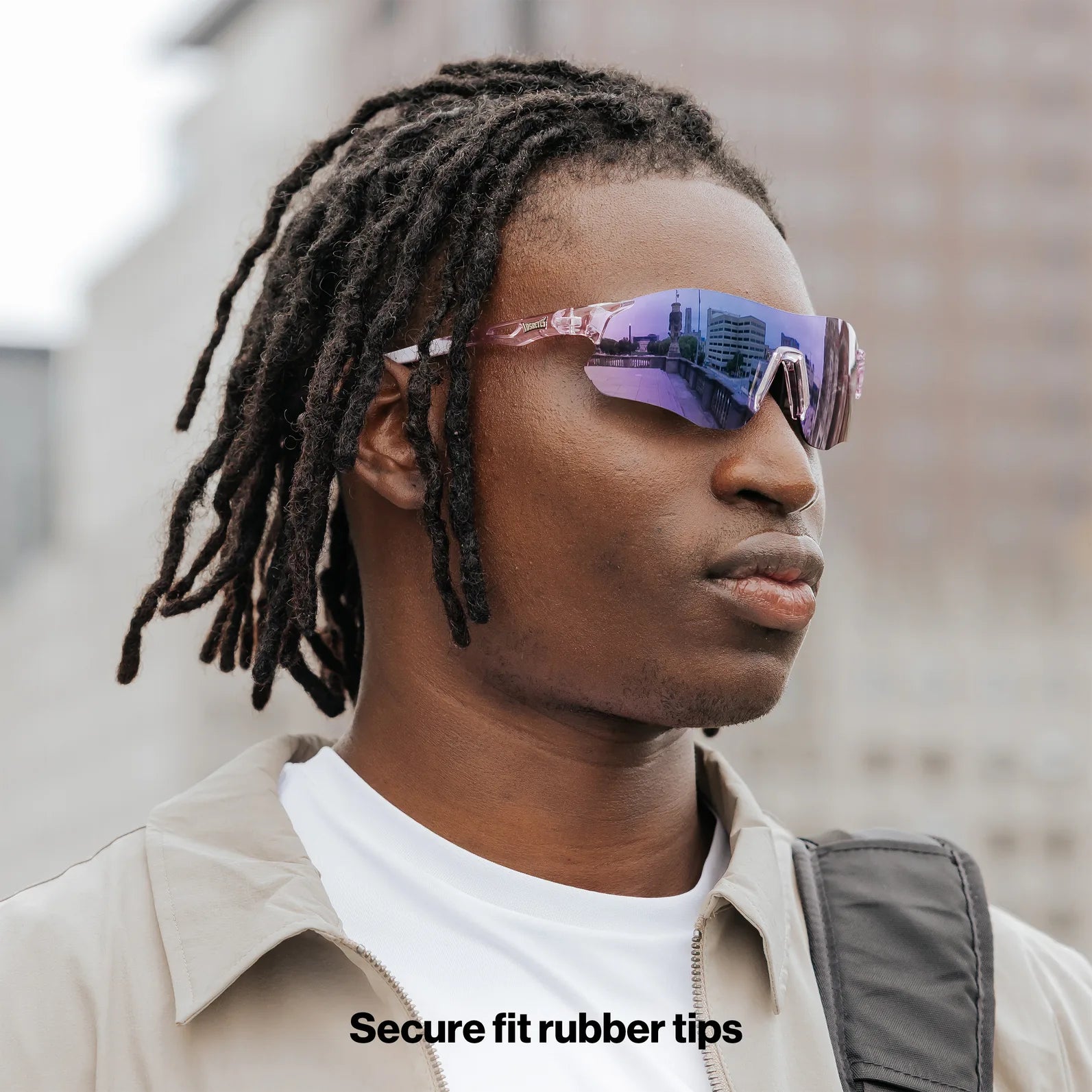 Side profile of model wearing Edge Royal sunglasses highlighting the purple mirrored lens finish.