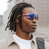 Side profile of model wearing Edge Royal sunglasses highlighting the purple mirrored lens finish.