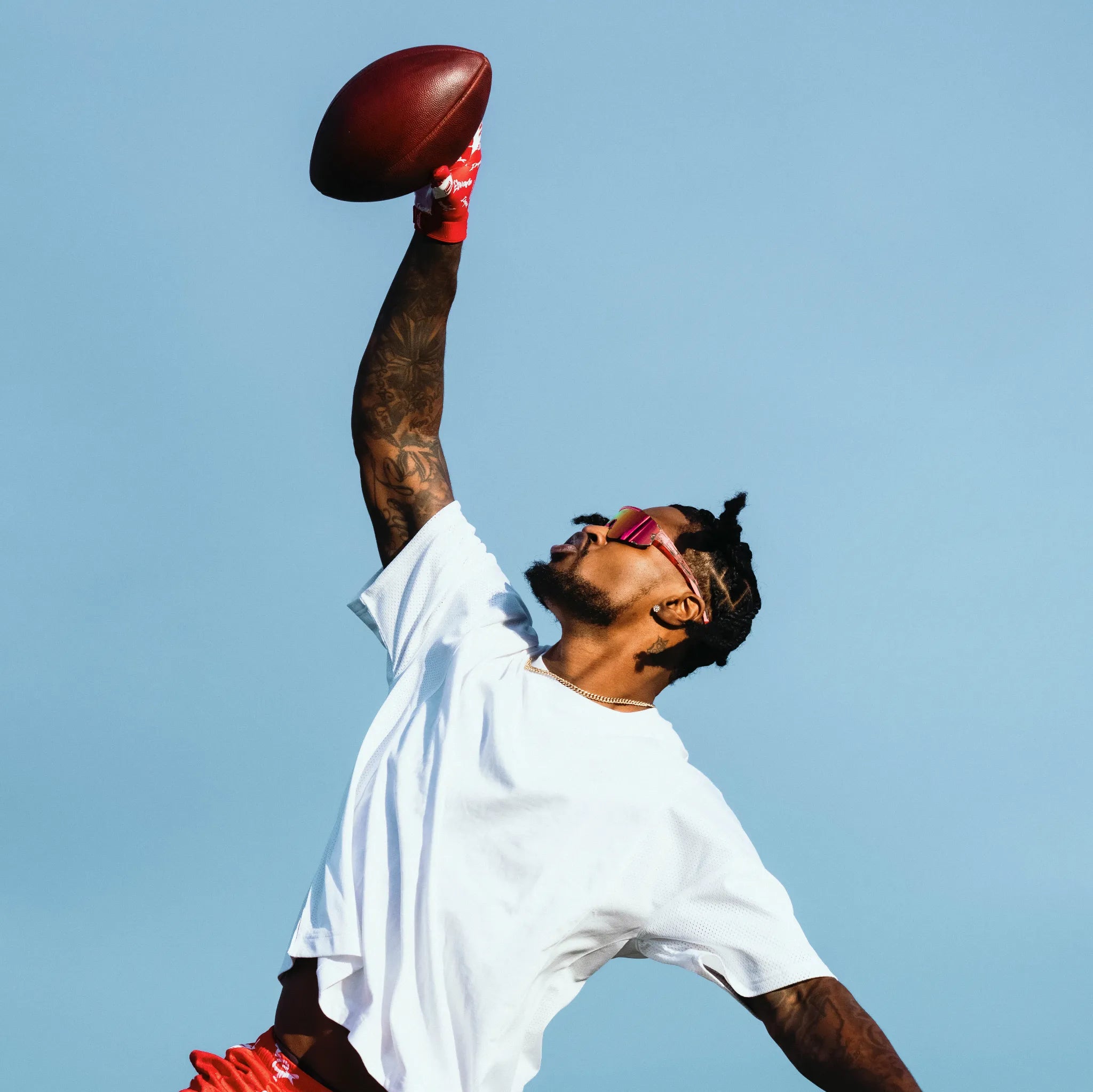 Ross500 in pink LosReyes Bubble Gum Elevate sunglasses during football drills, showing durable TR90 frames and full UV400 protection