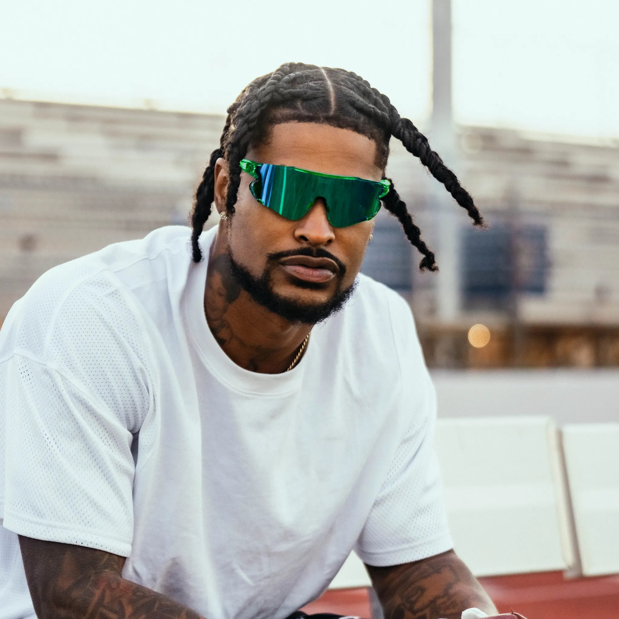Ross500 wearing bright green LosReyes Cactus Elevate sunglasses on the football field, featuring polarized clarity and seawater-resistant lenses, $48