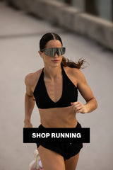 Woman running in LosReyes Elevate sunglasses; sweatproof, secure-fit athletic eyewear designed for marathon training, cardio, and high-movement workouts.