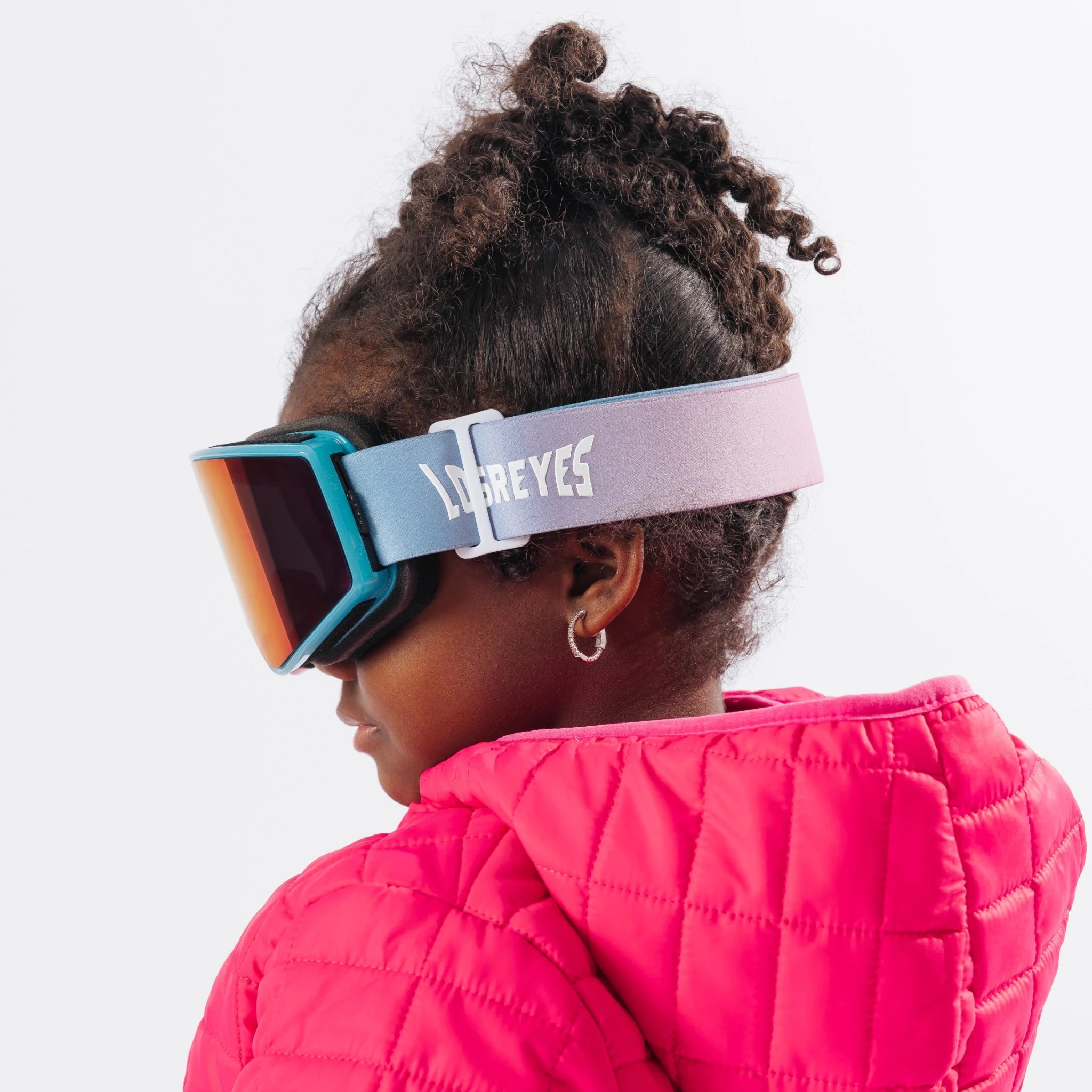 Child wearing LosReyes Everest Cotton Candy snow goggles side profile