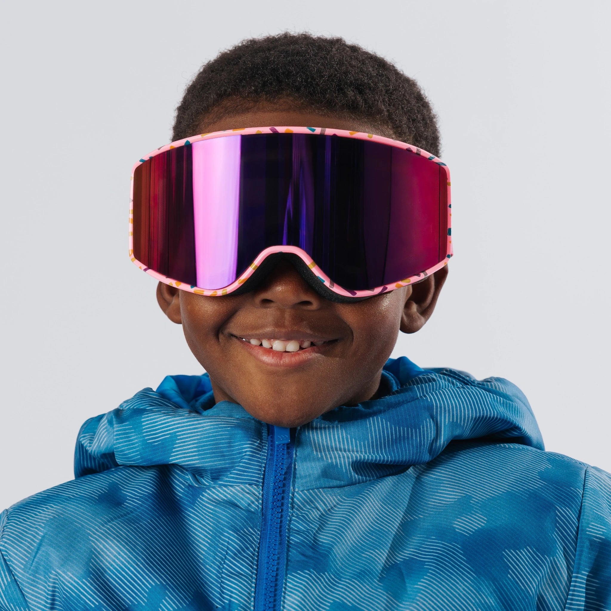 Front view of child wearing LosReyes Everest Cream snow goggles