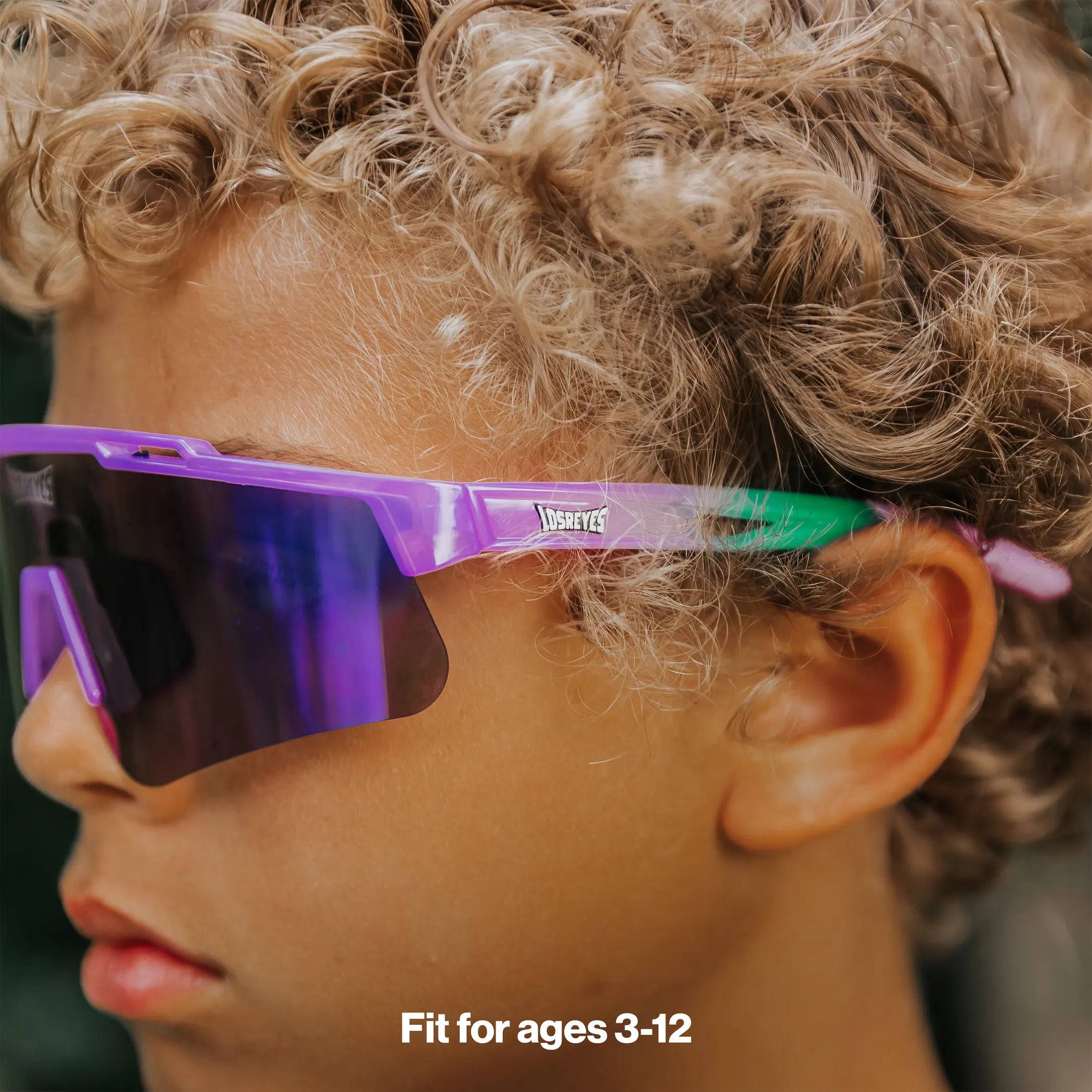 Side profile of youth wearing LosReyes Jurassic Series Brontosaurus purple sunglasses
