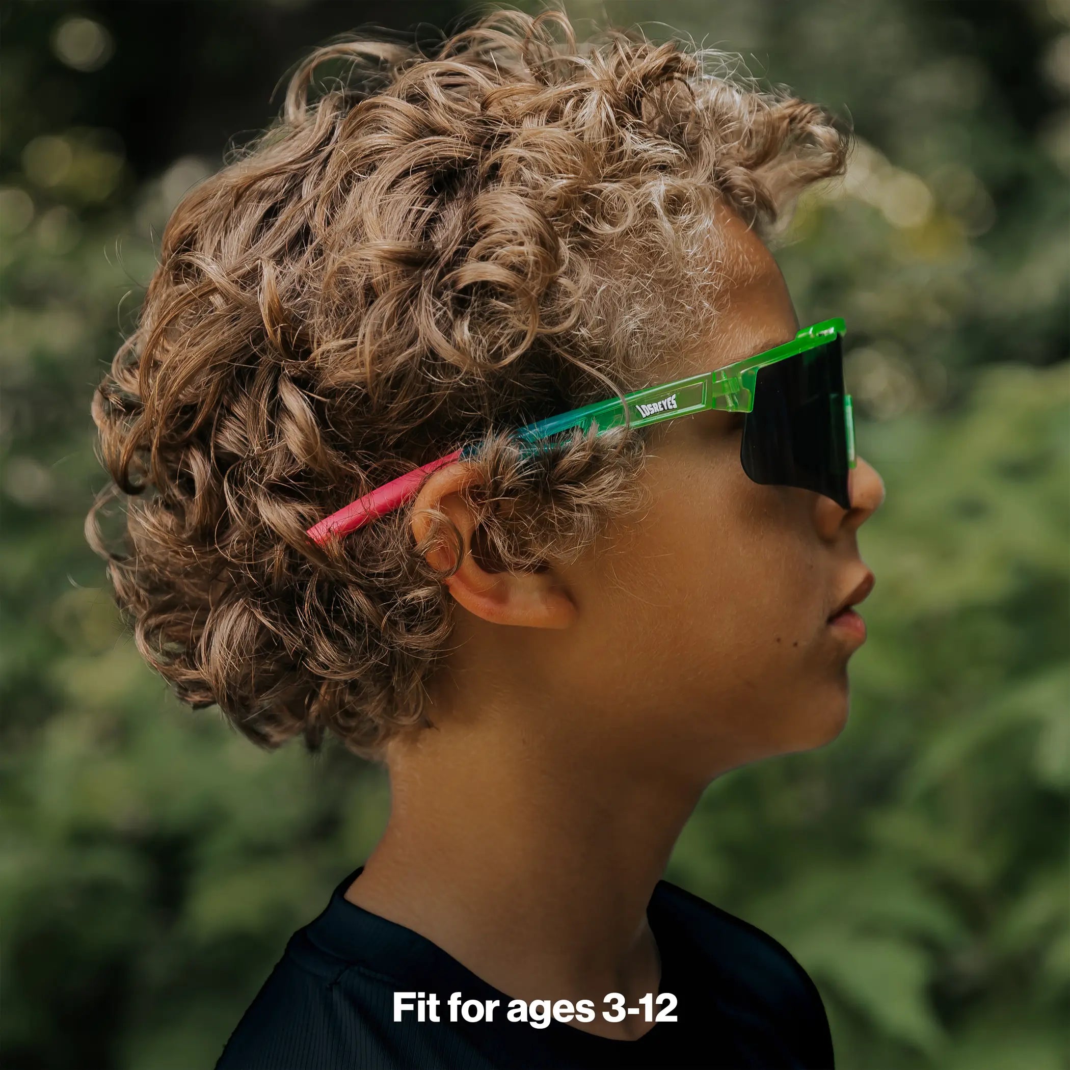 Youth wearing LosReyes Jurassic Series Pterodactyl green sunglasses outdoors