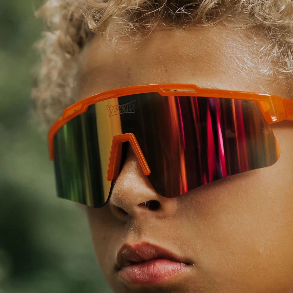 Close-up of youth wearing LosReyes Jurassic Series Triceratops orange sunglasses