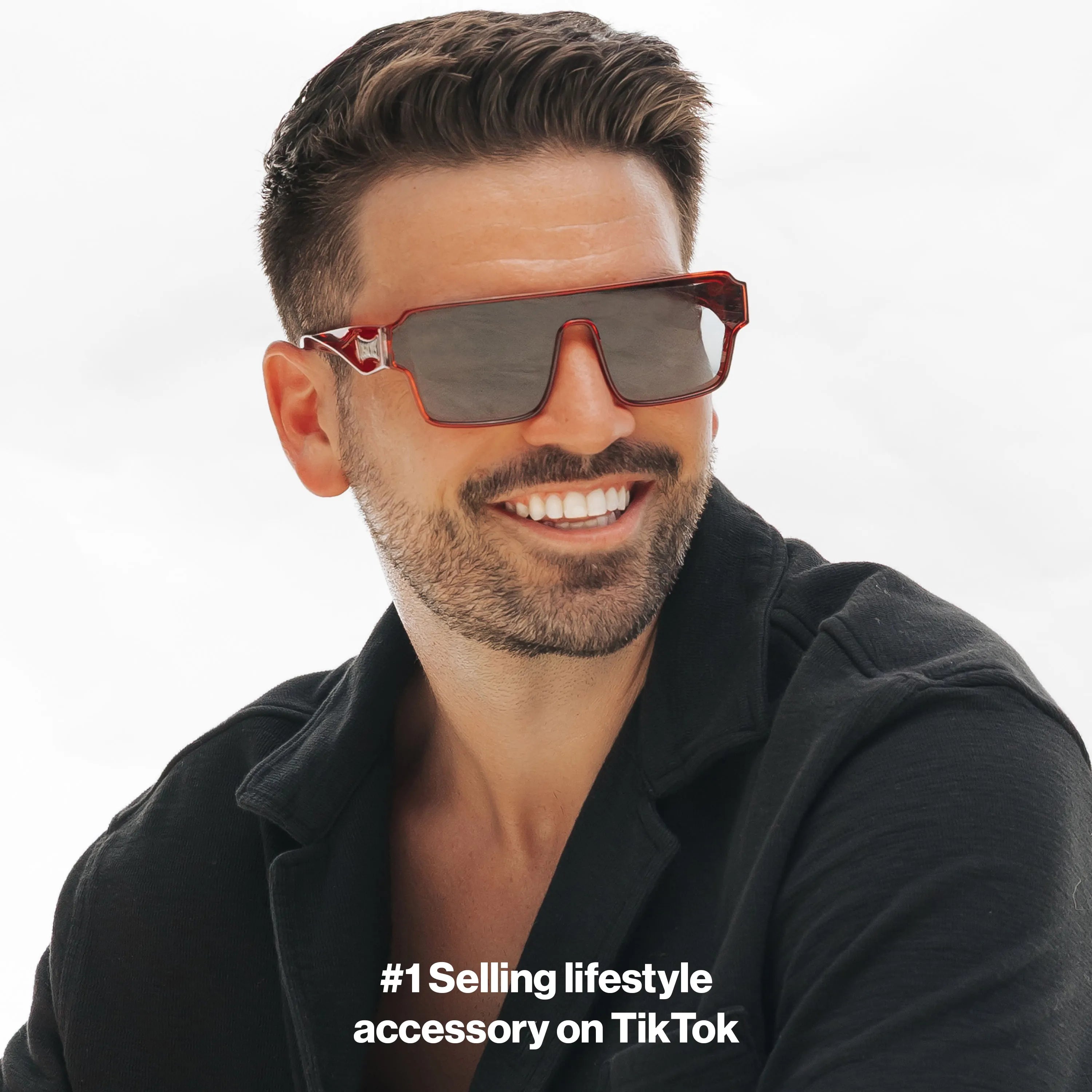 Man wearing Ares Omega sunglasses made by LosReyes and a black jacket on a white background