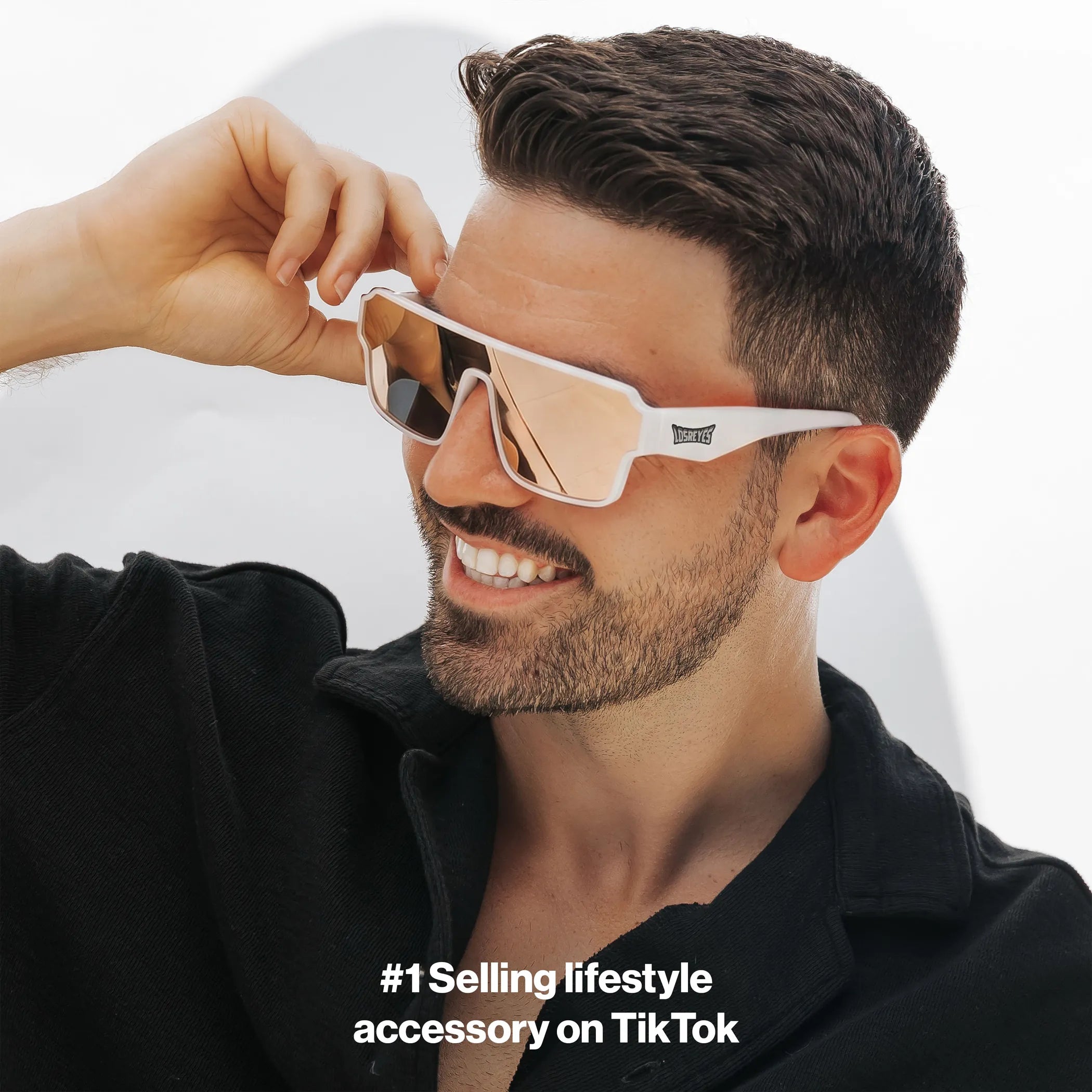 Man wearing LOSREYES Omega Athena lifestyle sunglasses with white frame and rose gold reflective mirror lens