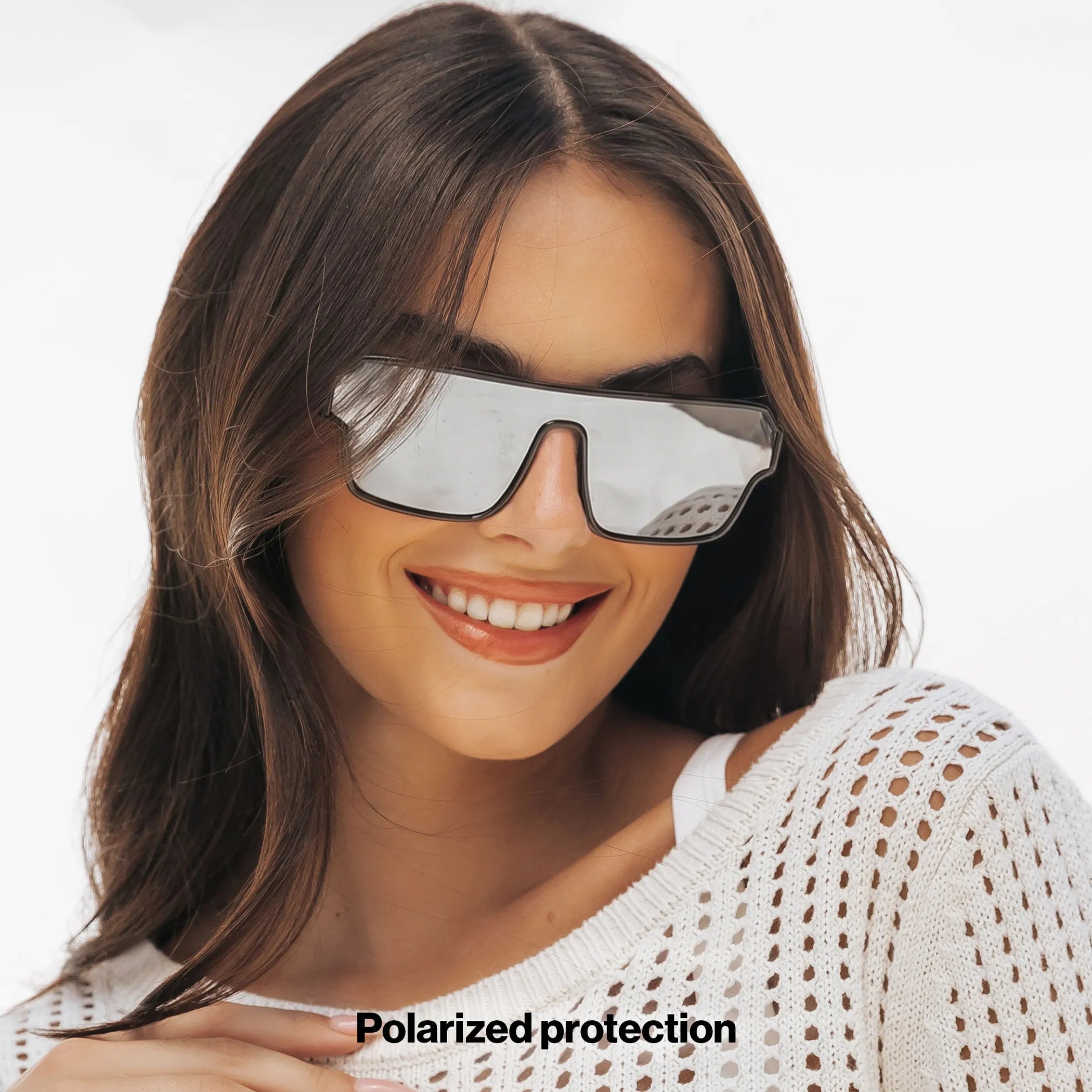 Woman wearing LOSREYES Omega Hades lifestyle sunglasses with black frame and silver reflective mirror lens