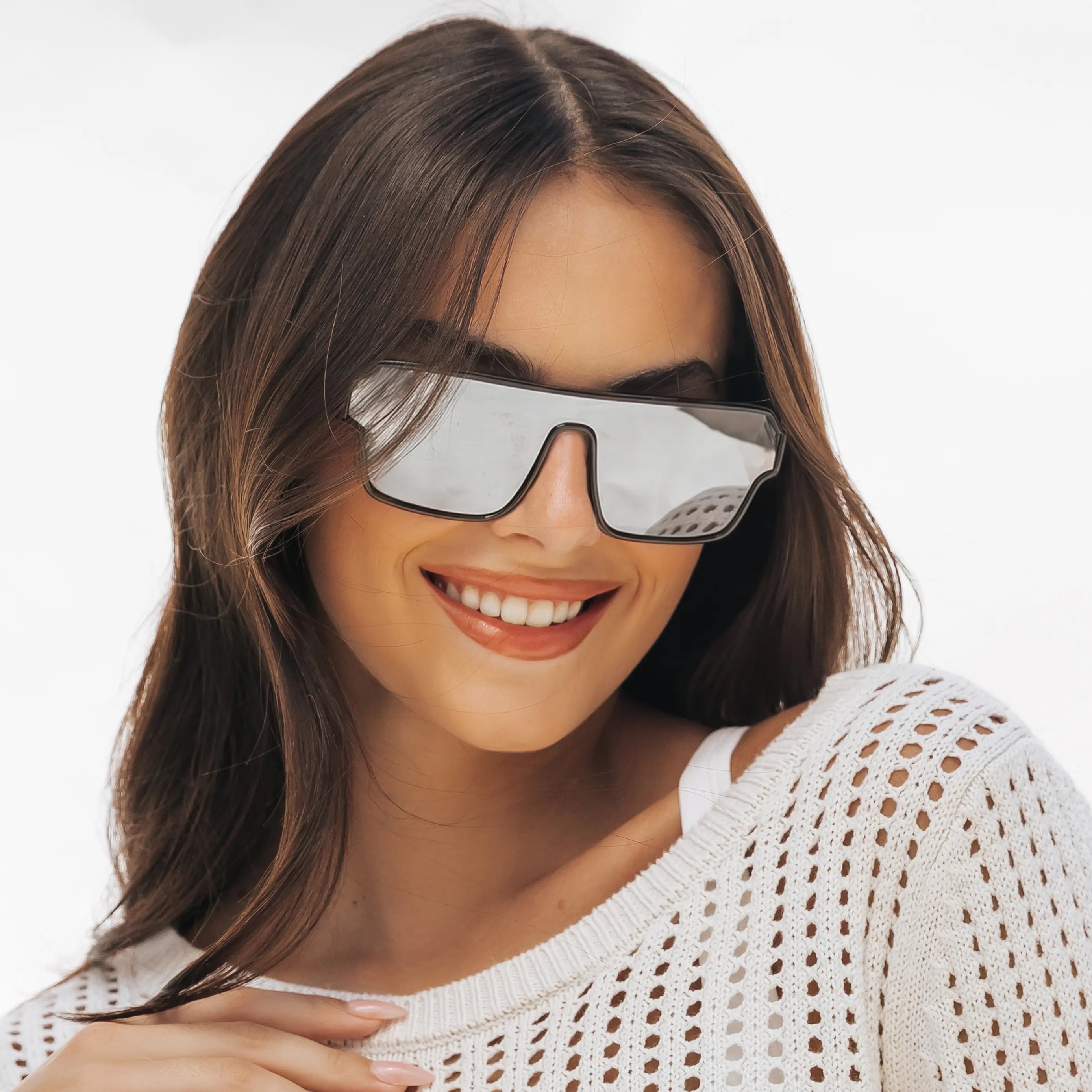 Woman wearing LOSREYES Omega Hades lifestyle sunglasses with black frame and silver reflective mirror lens