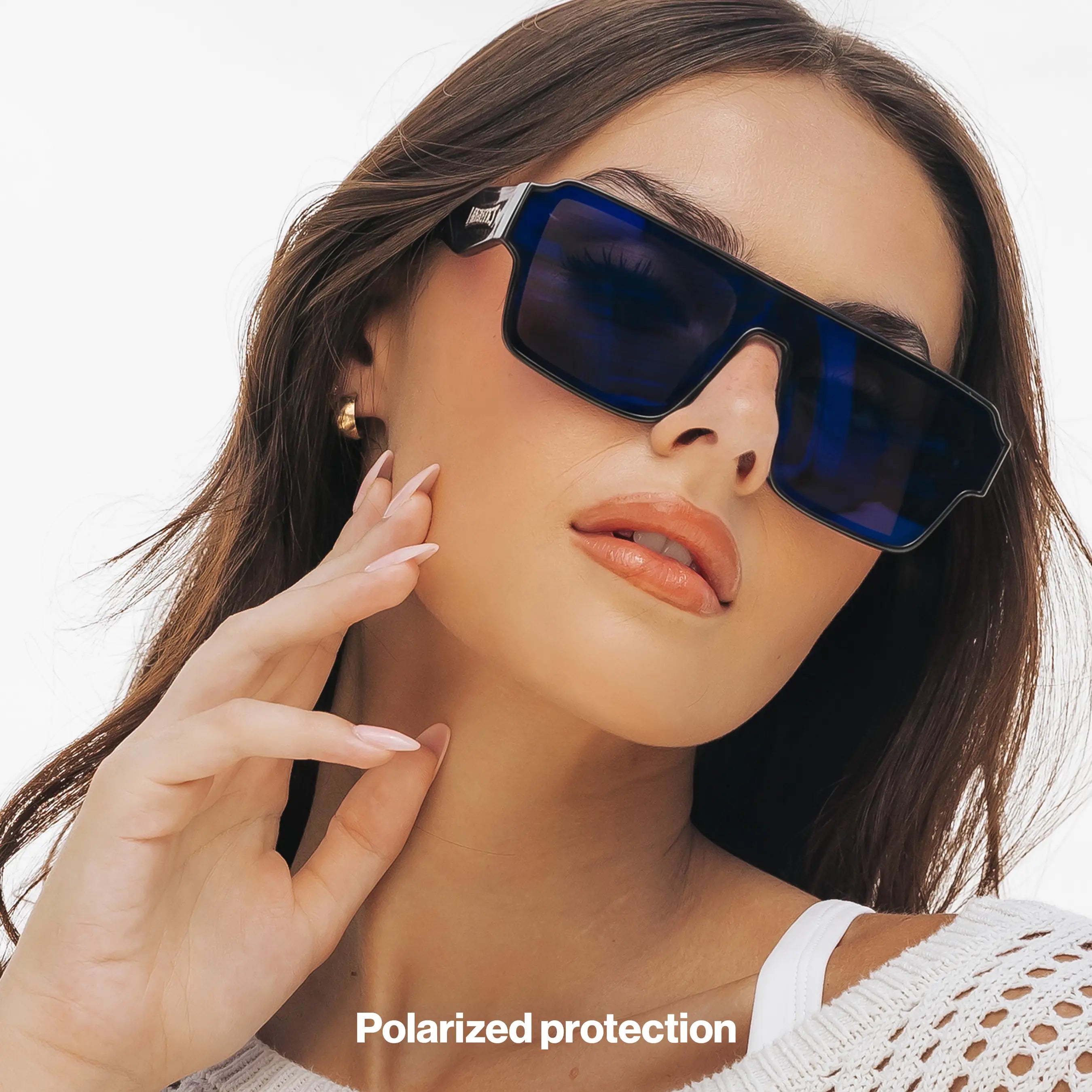 Woman wearing LOSREYES Omega Poseidon lifestyle sunglasses with black frame and deep blue reflective mirror lens