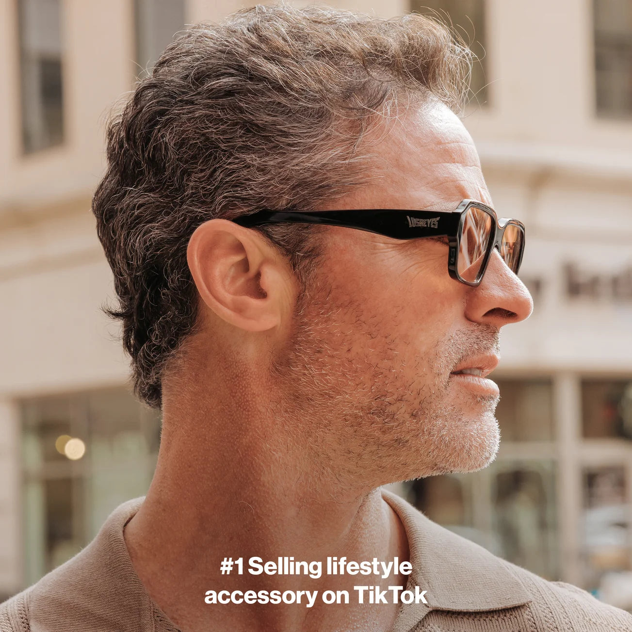 Man wearing LosReyes Opus Positano black frame sunglasses with orange lenses – premium fashion eyewear