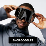 Model wearing oversized LosReyes performance goggles with shield-style black lens.