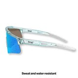 Side studio view of LosReyes Prime Galaxy Uranus blue athletic sunglasses featuring lightweight transparent blue speckled frame, white temples, and anti-slip ear grips for high-motion wear.