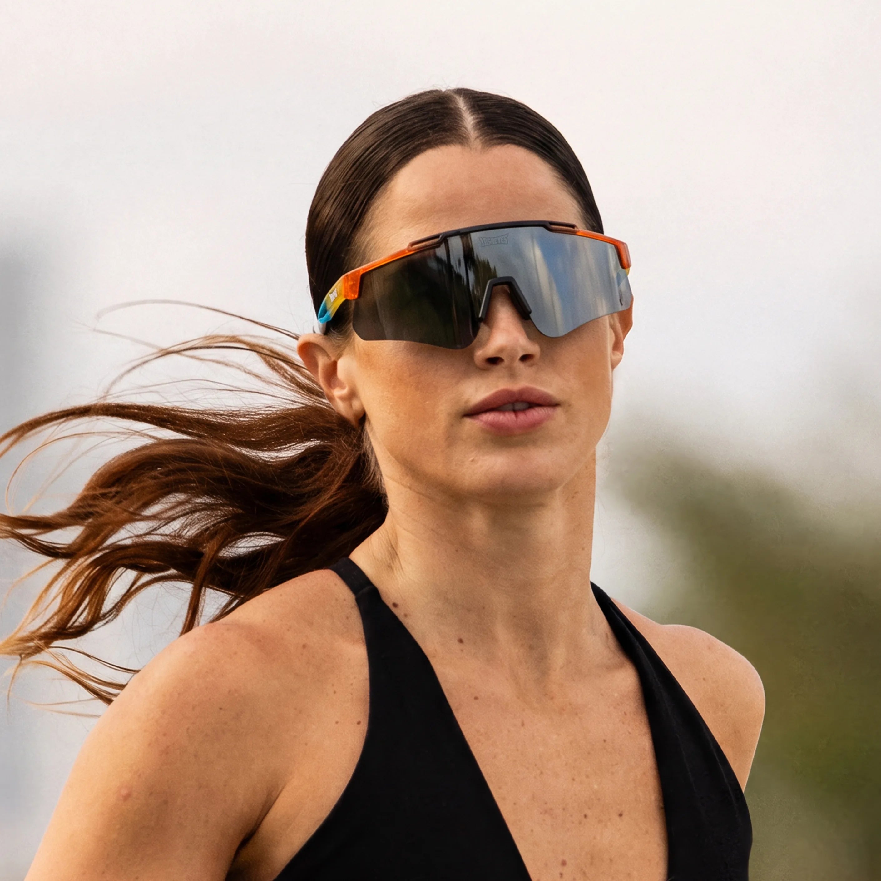 Woman running outdoors in LosReyes Prime Summer Drop limited edition sunglasses, sunset gradient frame
