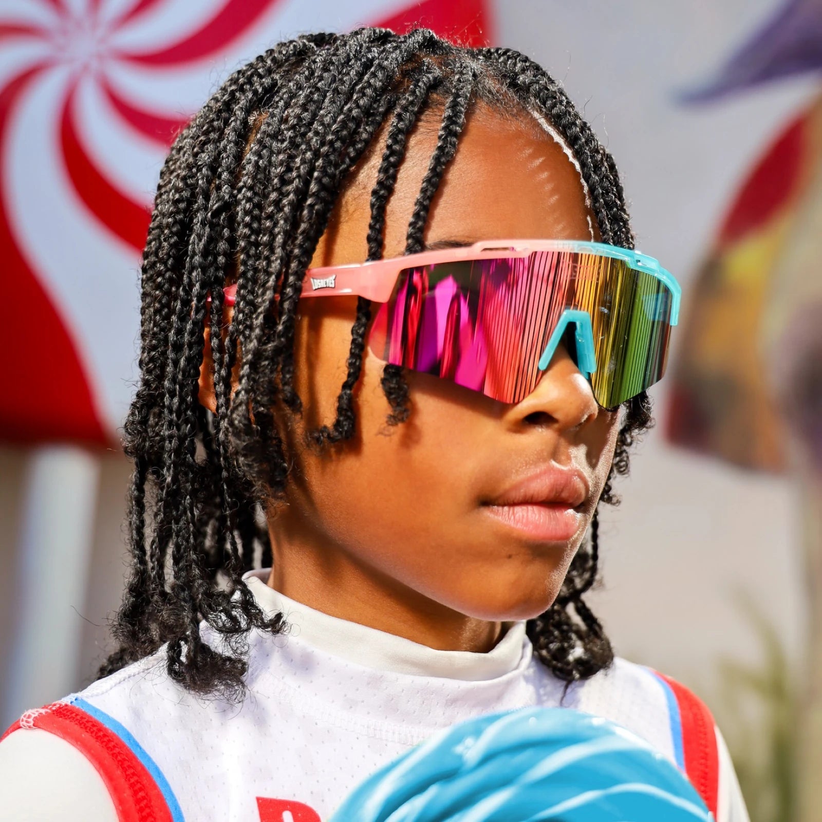 Front view of LosReyes Prime Youth Cotton Candy sports sunglasses worn by child, featuring mirrored UV400 pink-orange lens and dual-tone pink and blue frame, ideal for active kids and stylish protection