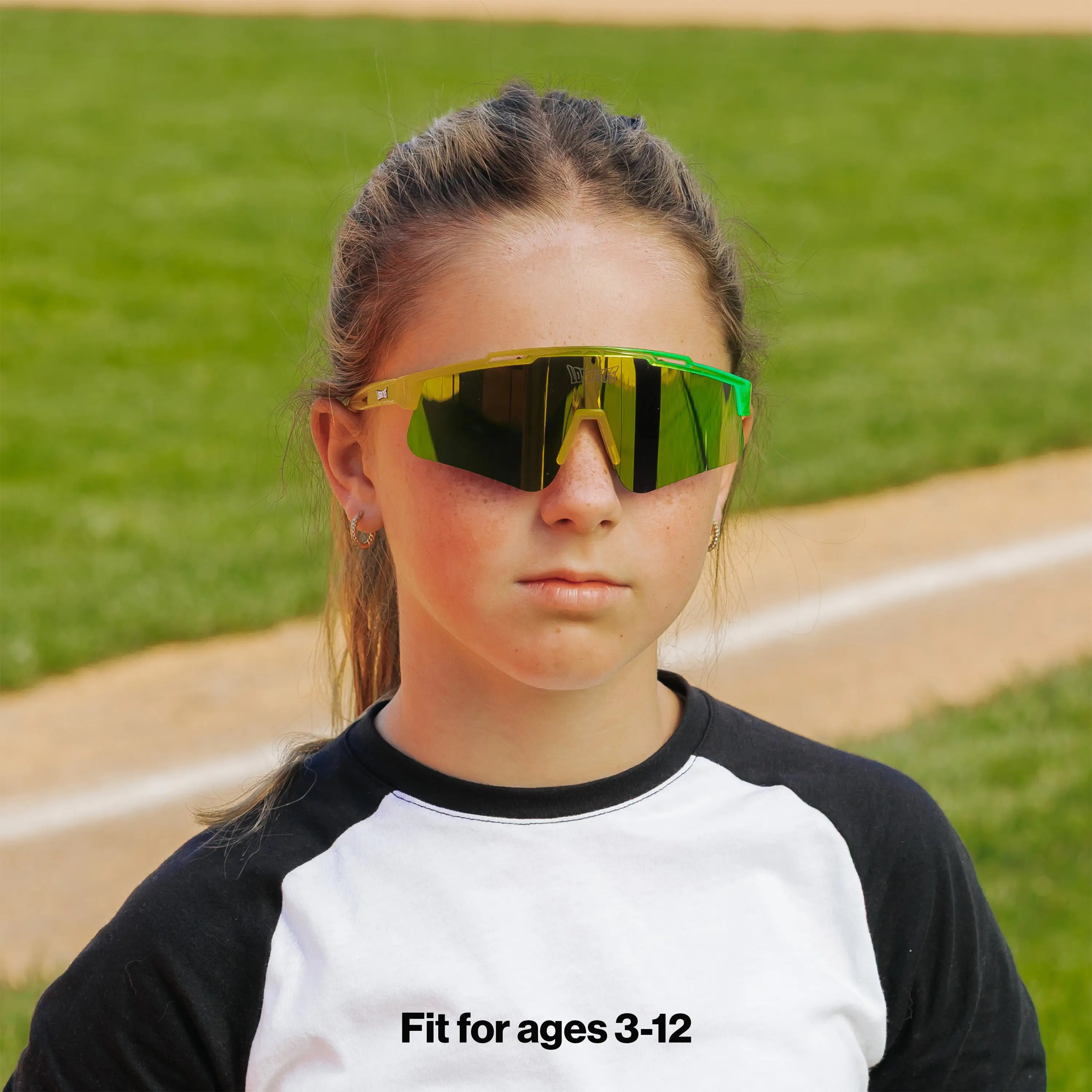 LosReyes PrimeYouth Candy Collection "Banana" youth sunglasses with UV400 protection on baseball field
