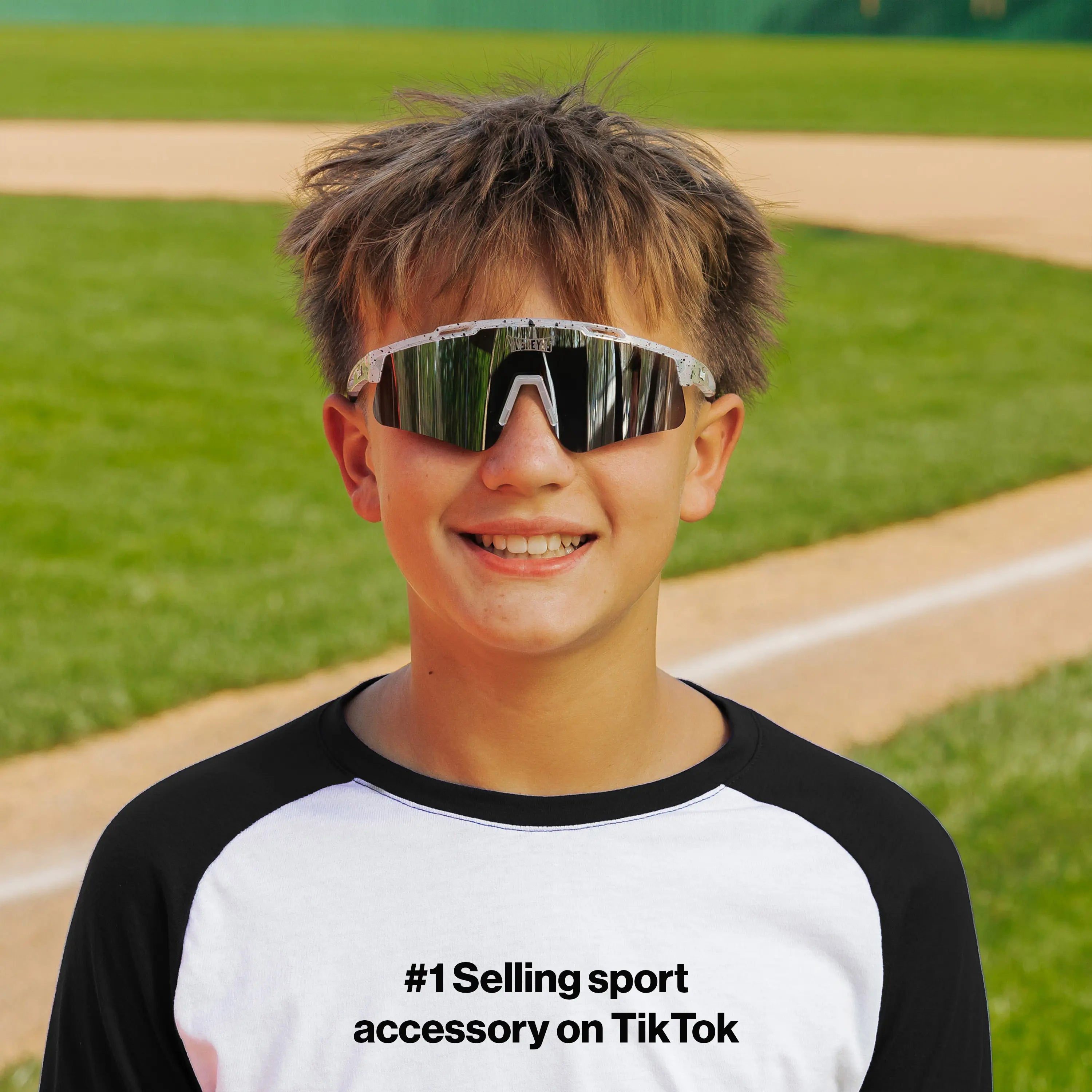 LosReyes PrimeYouth Candy Collection "Cookie" youth sunglasses with UV400 protection on baseball field