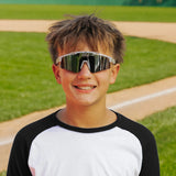 LosReyes PrimeYouth Candy Collection "Cookie" youth sunglasses with UV400 protection on baseball field