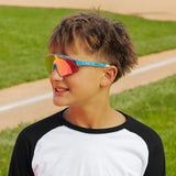 LosReyes PrimeYouth Candy Collection "Cotton Candy" youth sunglasses with UV400 protection on baseball field